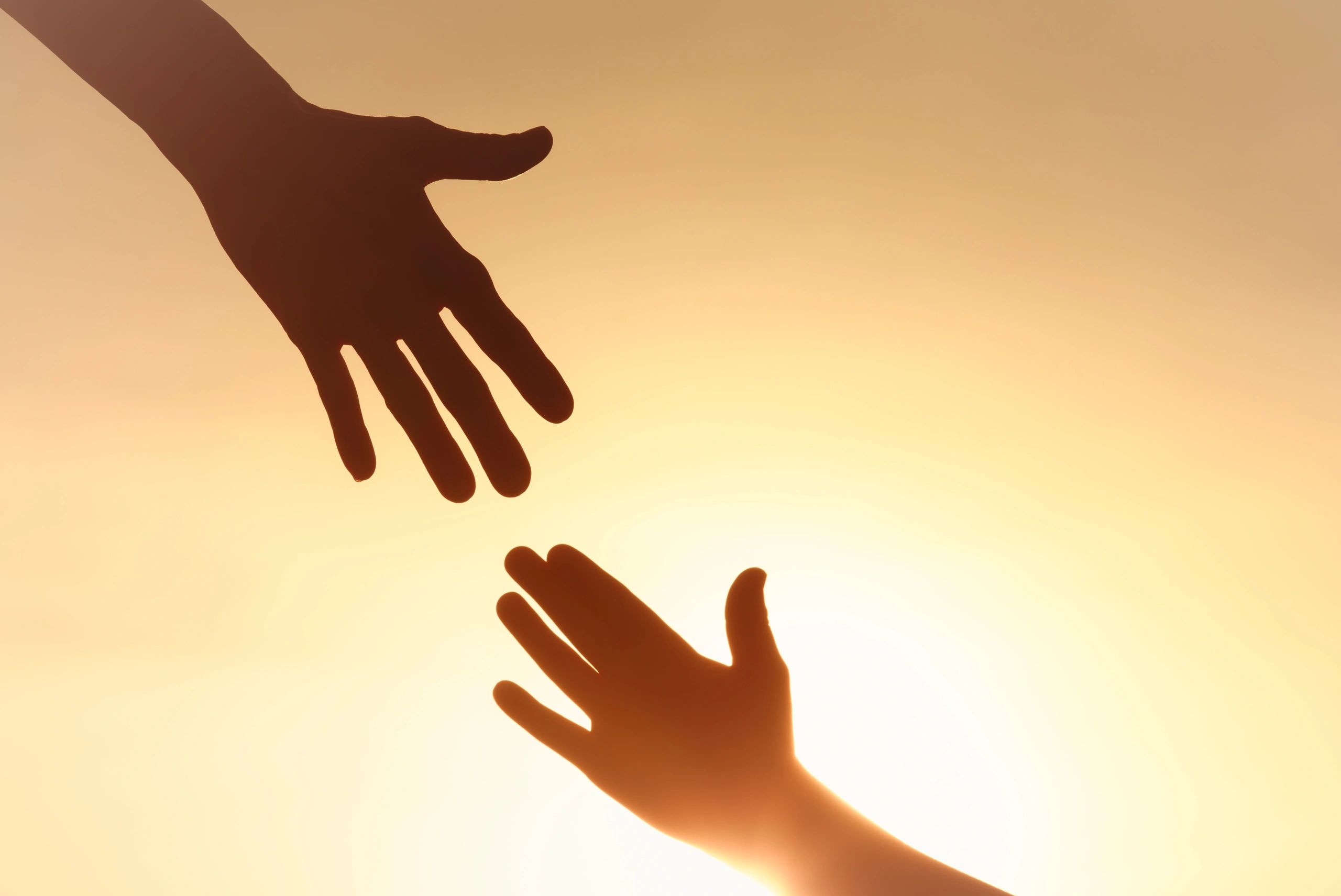 Helping family hands clasped together